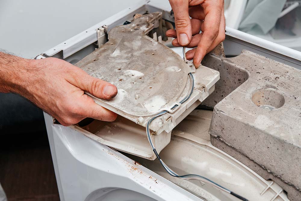 handyman repairing a washing machine the hands of 2022 02 22 05 48 13 utc